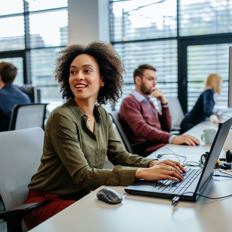 Woman in office and on-the-job-with-a-smile